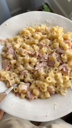 a white plate topped with macaroni and cheese