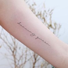 a woman's arm with a tattoo that reads, love you forever