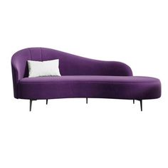 a purple couch with white pillows on it