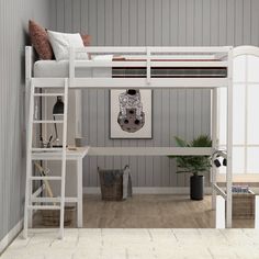 a white bunk bed sitting next to a wooden desk