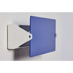 a blue and white wall mounted shelf with a light on it's left side