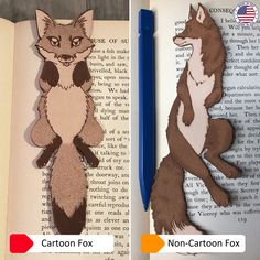 an open book with cut out images of a fox and a cat sitting on it