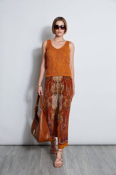 Our Boho Raj Paisley print gives chic expression to Summer's must-have pant. The relaxed fit, drawstring waist & engineered print design define effortless Summer dressing and will transition into your Fall wardrobe.    Elie Tahari Exclusive    Silk Raj Paisley Printed Cargo Pants with Elastic Waistband    100% Silk    Runs true to size.    Measurements: Inseam 27.5"L, Front Rise 12"L (approx. length for size S)    Model is 5'9" and wearing size XS    Imported    Style #: E7018204 Printed Cargo Pants, Summer Dressing, Print Pant, Long Sleeve Short Dress, Elie Tahari, Knit Tees, Denim Coat, Printed Pants, New Arrival Dress