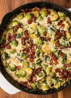 a skillet filled with bacon, brussel sprouts and other toppings