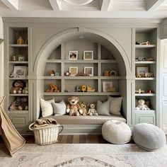 a child's room with built in bookshelves and stuffed animals