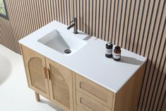 a bathroom vanity with two bottles on it