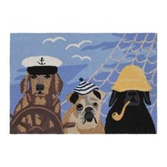 three dogs wearing hats and sitting on a boat in the ocean with a sailboat behind them