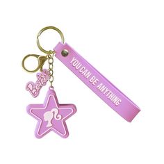 a pink keychain with a star and you can be anything on it