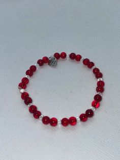 Red rounded beads complimented with clear rounded beads perfect for Valentines day. 20cm circumference 6.3cm diameter made with clear stretchy string. Can be made to any size on request. Will receive item in a gift bag. Clear Beaded Stretch Bracelet As Gift, Red Stretch Bracelet For Valentine's Day Gift, Red Stretch Bracelet With Round Beads For Gifting, Clear Beaded Bracelets As A Gift, Clear Beaded Bracelets For Gift, Red Stretch Bracelet With Round Beads For Gift, Faceted Beads Stretch Bracelet Gift, Red Round Beads Bracelet For Valentine's Day, Red Stretch Bracelet With Heart Beads