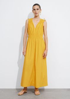 Sleeveless midi dress finished with ties at the shoulders.• V-cut neckline secured with a tie detail• Accentuated waistline Summer Style Guide, Yellow Midi Dress, Knit Outerwear, Linen Sweater, Beachwear Fashion, Sleeveless Midi Dress, Beauty Dress, Dress Yellow, V Cut