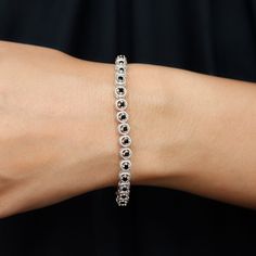 Product Details The mesmerizing Tennis Bracelet comes with 4 Prong Set Round Lab Created Black Diamonds inside Rope Frame on the Tennis Style. This Comfort Fit Bracelet is a perfect Birthday Gift for your spouse. Product Information SKU SHP-BRACELET062193168 Length 177.8 mm Width 5 mm Height 3.6 mm Weight 9.44 gm (Approximate) LAB CREATED BLACK DIAMOND INFORMATION No.of Stones 34 Pieces Total Weight 6.63 Carat (Approximate) Dimension(approx) Round-3X3 mm-34 Pcs Color Black Cut Brilliant Shape Ro Rope Frame, Tennis Style, Diamond Tennis Bracelet, Fitness Bracelet, Perfect Birthday Gift, Black Diamonds, Yellow Gold Bracelet, Tennis Bracelet Diamond, Perfect Birthday