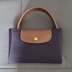 Longchamp Le Pliage Medium Top Handle Bag In Bilberry. One Inside Pocket. Euc A Couple Marks Shown In The Pics Le Pliage Medium, Longchamp Le Pliage Medium, Longchamp Bags, Handle Bag, Longchamp Le Pliage, Womens Tote Bags, Color Purple, Inside Pocket, Top Handle