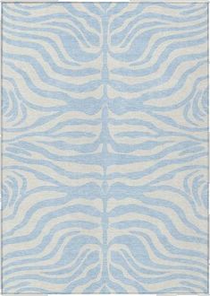 a blue and white rug with wavy lines