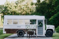 an old bus is decorated with greenery and wreaths