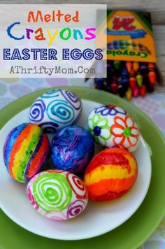 colorful easter eggs on a plate with crayons in the background and text overlay that reads melted crayons easter eggs