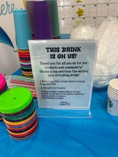 there is a sign on the table that says, this drink is on us thank you for all you do for our students and community