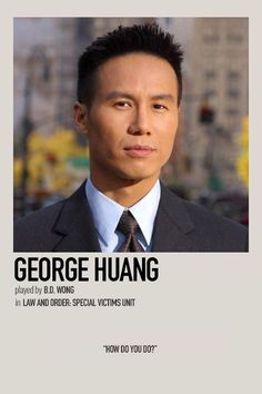 a man in a suit and tie with the words george huang on it's back