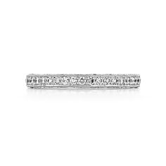 This perfectly named Tacori Blooming Beauties wedding band blossoms into a gorgeous arrangement of detail and diamonds, guaranteed to captivate your beloved with its striking nature. A classic platinum band holds a captivating string of pavé-set diamonds, while astonishing reverse crescents glisten along the inner face of this women's band. This blooming diamond band will serve as a constant reminder of your ever flourishing devotion to one another. Wedding Eternity Band With Lab Grown Diamonds, Wedding Lab Grown Diamond Eternity Band, Luxury Baguette Cut Eternity Band For Wedding, Classic Diamond White Platinum Bridal Sets, Classic Platinum Bridal Set In Diamond White, Luxury Cubic Zirconia Eternity Band For Wedding, Luxury Cubic Zirconia Wedding Eternity Band, Timeless Eternity Band For Wedding With Lab Grown Diamond, Classic Diamond Cut Bridal Sets