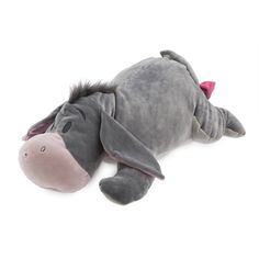 a gray stuffed animal laying on top of a white floor next to a pink nose