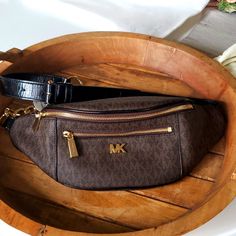 Brand New With Tags Michael Kors Logo Brown Fanny Pack Belt Bag. You Can Wear It Many Ways Across Your Chest Or Around Your Waist Like A Belt. Can Be Adjusted. Has A Beautiful Gold Hardware Chain. Also Comes With A Micheal Kors Dust Bag. Brown Pouch Bag With Branded Hardware, Michael Kors Brown Coated Canvas Bag, Michael Kors Brown Shoulder Bag For Travel, Michael Kors Brown Everyday Bags, Designer Brown Bags With Zipper Closure, Michael Kors Brown Bag With Removable Pouch, Michael Kors Classic Brown Bag, Brown Pouch Bag With Gold-tone Hardware, Luxury Brown Michael Kors Shoulder Bag