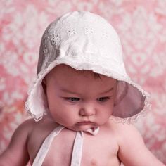 Exquisitely constructed, our classic white bonnet has a flared brim to help shade little faces from the sun. Elastic at back of neck adds a bit of fit. Ties closed to keep bonnet in place. Perfect for the beach, and everyday wear, this lightweight hat is functional and cute. Made in white eyelet embroidered with hearts.• Shell: 100% Cotton, Lining: 65% Cotton, 35% Polyester• Cold handwash, Lay flat to dry• Made in China White Summer Sun Hat For Playtime, White Sun Hat With Uv Protection For Playtime, Adjustable White Sun Hat For Playtime, White Sun Hat With Curved Brim For Playtime, White Curved Brim Sun Hat For Playtime, White Spring Bucket Hat For Playtime, White Bucket Hat For Spring Playtime, White Bucket Hat For Playtime In Spring, White Cotton Sun Hat For Playtime