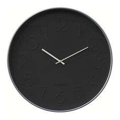 a black clock with numbers on the face