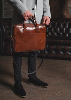 The leather brown briefcase for men, from ShLeatherBags, with simple, modern lines and timeless design features. The main spacious compartment has padding to better secure and protect your laptop and documents. Our messenger bag includes a removable shoulder strap and carrying handles for comfortable transportation. This minimalist briefcase is suitable for men and women. Ideal for work! EXTERIOR:- Genuine leather- Two handles- One shoulder removable belt- Large back pocket for magazines, newspa Mens Leather Bag Work Men's Briefcase, Men Work Bag, Laptop Bags For Men Style, Leather Laptop Bag For Men, Brown Briefcase, Brown Leather Laptop Bag, Leather Office Bags, Mens Leather Laptop Bag, Office Bags For Men