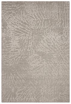 a rug with an abstract design on the front and back of it, in grey tones