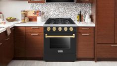 a black stove top oven sitting in a kitchen next to wooden cabinets and counter tops