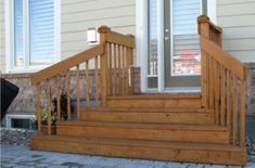 wooden steps leading up to the front door of a house