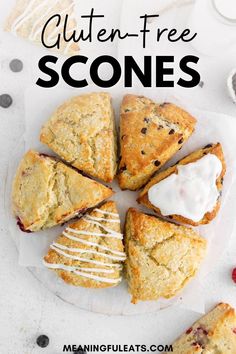 gluten - free scones with blueberries and cream in the middle on a plate