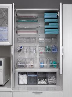 the inside of a medical cabinet filled with lots of supplies and items in bins