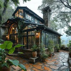 the house is surrounded by greenery and stone steps leading up to it's entrance