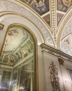 an ornate ceiling with paintings on it