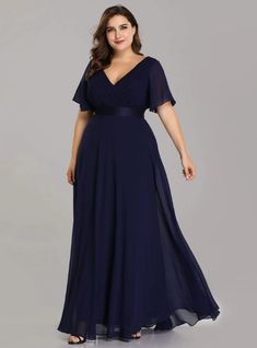 a woman in a long blue dress with an open neckline and short sleeves, wearing a