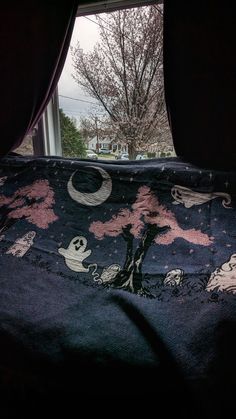 an image of a bed in the dark with halloween decorations on it's cover