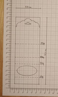 a piece of paper that has a drawing on it with a ruler next to it