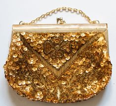 A vintage mid twentieth century gold sequin and beaded clutch handbag or purse with original chain strap. In good condition, light wear and use evident, occasional area of fraying. Approx. 19 x 15 cm with a chain length of approx. 30 cm. Vintage Bags For Festivals, Gold Sequined Clutch Evening Bag, Gold Sequined Rectangular Evening Bag, Vintage Gold Bags For Festive Occasions, Gold Sequined Evening Bag For Events, Gold Sequined Evening Bag For Formal Occasions, Gold Evening Bag With Sequins For Wedding, Festive Gold Sequined Bag, Gold Sequined Evening Bag For Wedding