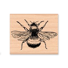 a rubber stamp with a bee on it