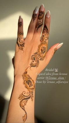 a woman's hand with henna tattoos on her left arm and the words bridal