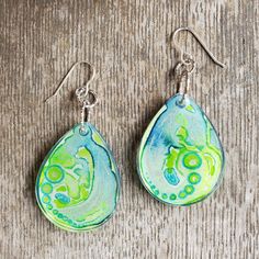 One-of-a-kind UV resin earrings featuring tiny watercolor paintings inspired by the flow of water. Hand-made with love.  Please NOTE care instructions: Avoid exposing resin jewelry to direct sunlight & extreme temperatures. Store in a cool, dry place. Do not submerge in water. Spot clean with mild soap & water & dry with a soft non-abrasive cloth. Tiny Watercolor Paintings, Uv Resin Earrings, Watercolor Earrings, Tiny Watercolor, Sewing Crafts Tutorials, Resin Earrings, Uv Resin, In Water, Mild Soap