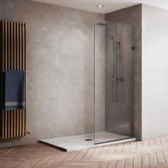 a walk in shower sitting next to a wooden radiator on a tiled floor