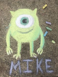 a chalk drawing of a green monster with the words make written on it