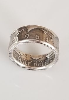 1964 JFK Half Dollar Coin Ring Polished Men's Vintage Ring  Woman's Vintage Ring Each one is handcrafted from a beautiful original clad JFK half dollar coin.  They can be made into a size 6-10 You must specify size when ordering. What a great way to celebrate a 58th Birthday or 58th Anniversary.  Kennedy half dollars make beautiful coin rings. 1964 was the first year of this coin,  and was the only year 90% silver coins were issued for general circulation. This 1964 Custom coin ring started as a Classic Etched Jewelry For Commemoration, Vintage Etched Jewelry For Commemoration, Vintage Stamped Jewelry For Commemoration, Vintage Commemoration Jewelry, 58th Birthday, Silver Coin Ring, Coin Rings, Polished Man, Italy Jewelry