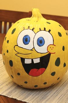 a pumpkin decorated with an image of a cartoon character