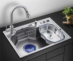 an image of a kitchen sink that is stainless steel