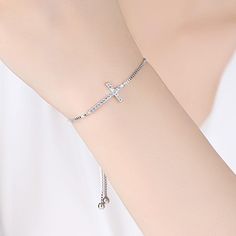 SKU#: OB040BTBracelet InformationMetal: Silver PlatedTotal Weight: 4.3gLength: 4.7''in/12cm(For Each Side)Size: 1.2*2.3cmClasp Type: Slider ClaspChain Type: Box ChainTheme: Faith CrossGem InformationGem Type: SapphireStone Color: WhiteStone Cut: Round CutStone Setting: Common Setting*Customized service of this item is available, please contact our customer service to place orders. Please notice that: the change of the stone color and plating color is available while the material of gemstones and Elegant Silver Beaded Cross Bracelets, Elegant Silver Cross Beaded Bracelets, Elegant Cross Beaded Bracelets As Gift, Elegant Cross-shaped Beaded Bracelets As Gift, Elegant Cross-shaped Beaded Bracelets For Gift, Metal Cross Bracelets, Elegant Adjustable Cross Beaded Bracelets, Elegant Cross Metal Bracelets, Elegant Adjustable Cross Bracelet