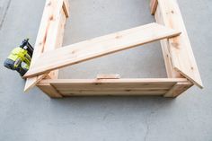 a piece of wood being assembled to make a bench