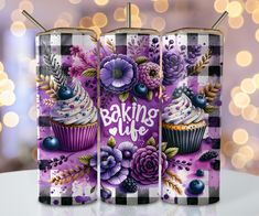 two purple cupcakes with frosting and flowers on them are next to each other