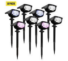 six solar powered garden lights with purple and white lights on each light, all in black